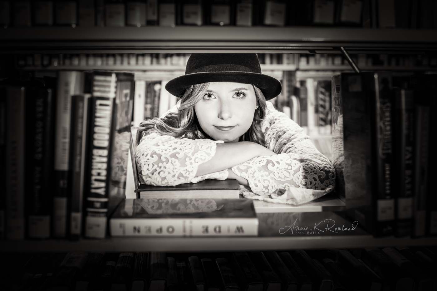 girl in library with books