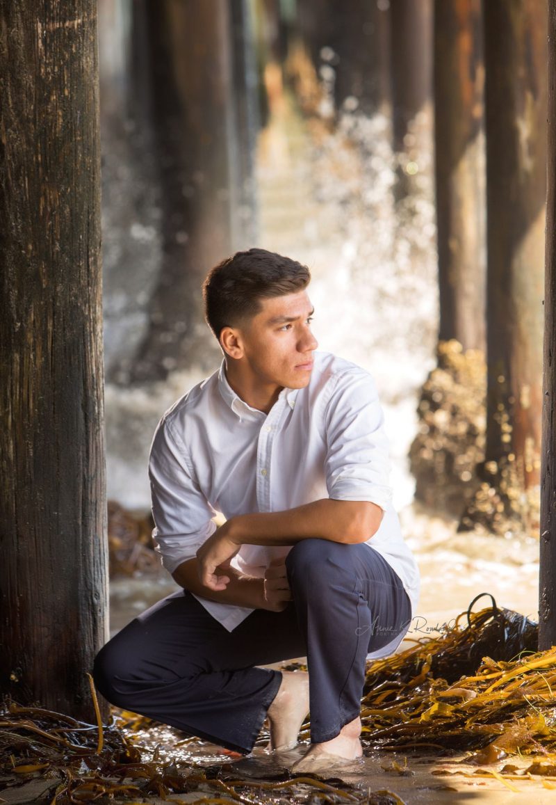 High school Senior boy on beach in santa cruz