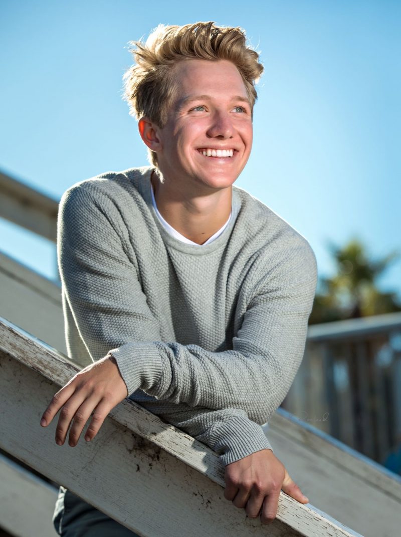 High school Senior boy on beach in santa cruz