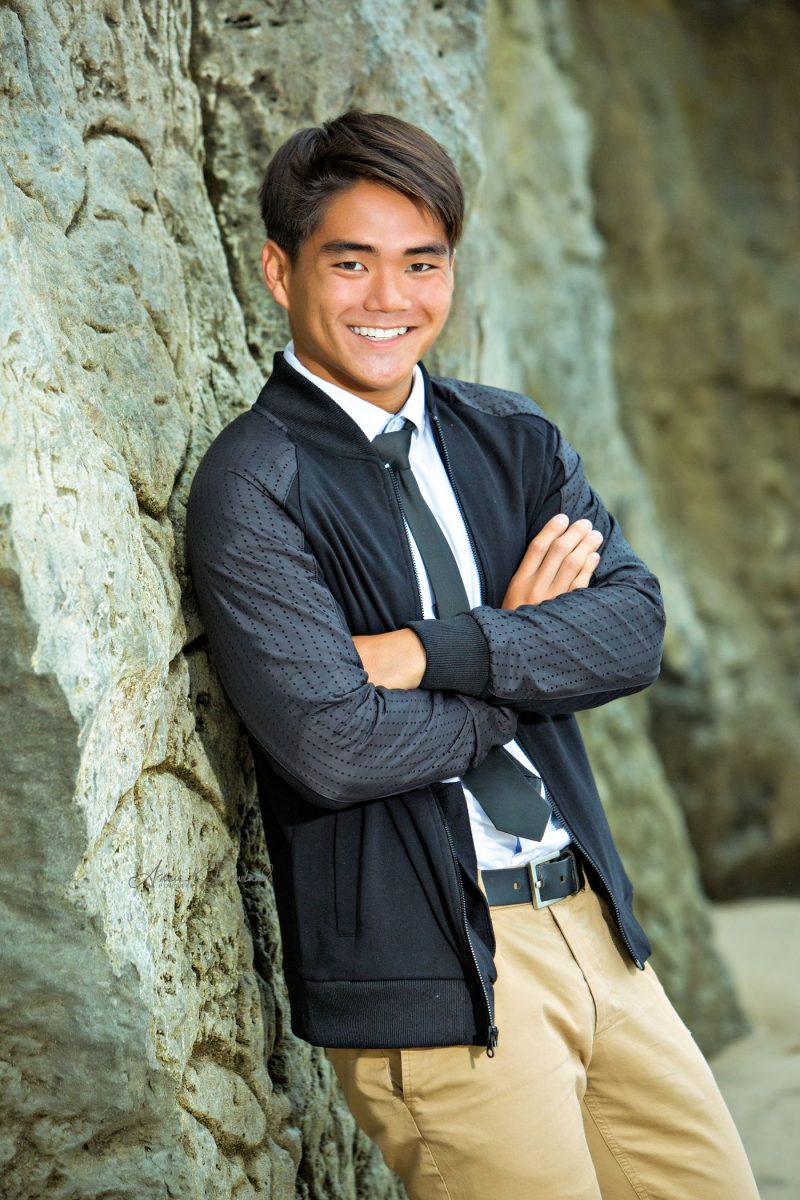 High school Senior boy on beach in santa cruz